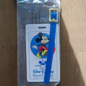 Vintage luggage tag is from the Walt Disney Travel Co